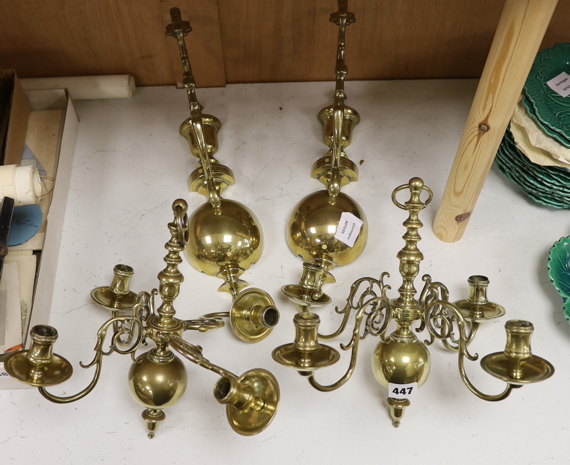 A pair of 19th century Dutch brass wall lights, each formed as a four branch chandelier with baluster stems supported by matching brackets, 36cm high